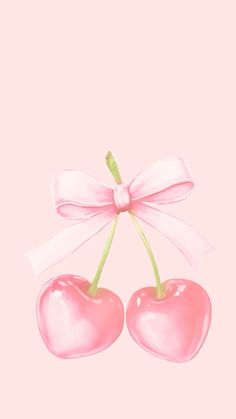 two cherries tied to a pink ribbon with a bow on it's end