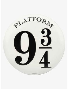 a white and black sign that says platform 9, with the number nine on it