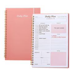 a pink planner book with daily plans on it