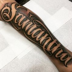 a man with a tattoo on his arm has the word edmonton written in cursive font