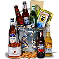 an assortment of beer and snacks in a bucket