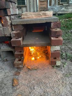 a brick oven with fire coming out of it