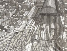 an aerial view of a train station in the middle of a city with lots of tracks