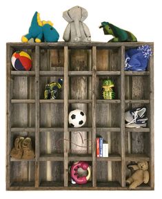 an old wooden crate filled with toys and stuffed animals on top of it's sides