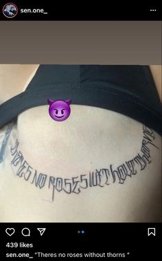 the back of a woman's stomach with an inscription on it that reads,