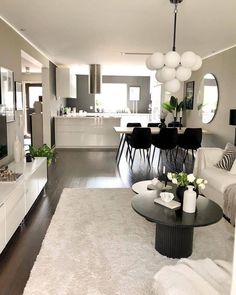 a living room filled with furniture and a flat screen tv