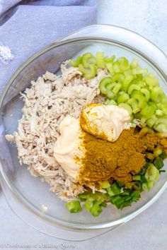 a glass bowl filled with different types of food