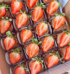 chocolate covered strawberries are arranged in a box