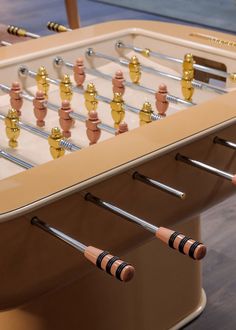 an old foosball table with several pieces of metal and wood on it's sides