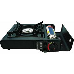 a black stove top with a gas burner on it