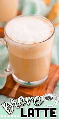 there is a cup of latte on the table with an advertisement for latte