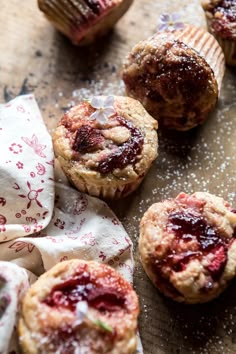 several small muffins with jam on them