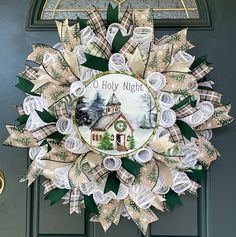 a christmas wreath on the front door of a house decorated with paper flowers and ribbons