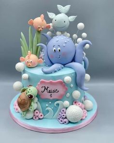 a blue cake with an octopus and sea animals on it