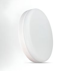 a white round object is shown against a white background with room for text or image