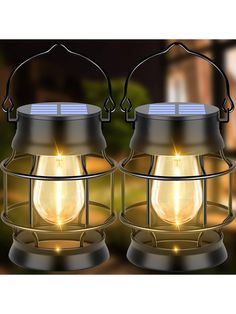 two metal lanterns with solar lights on them