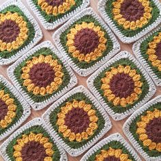 crocheted coasters are arranged in rows on a table with brown, yellow and green accents