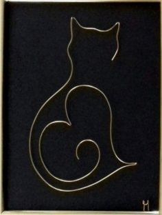 a gold frame with a black cat on it