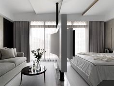 a modern bedroom with white and black decor