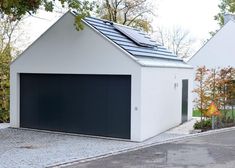 two garages with solar panels on the roof