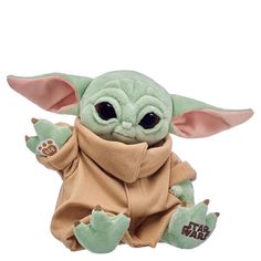 the child yoda plush toy is sitting down