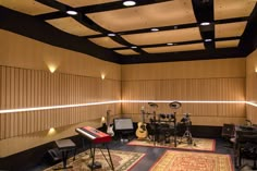 a recording room with musical instruments and sound equipment