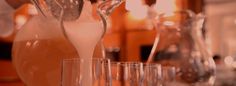 a pitcher and glasses on a table