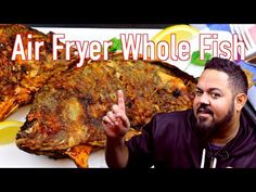 a man standing in front of a plate of food with the words air fryer whole fish on it