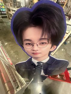 a person wearing glasses and a tie with a fake head in front of them at a store