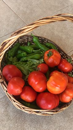 a basket filled with lots of different types of vegetables