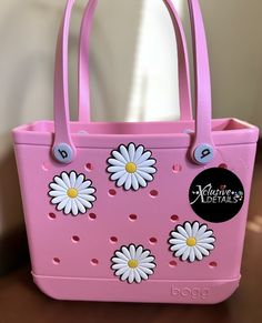 Hey Besties!  Welcome to our shop, we hope you enjoy💎🦋 ITEMS INCLUDED: * Jumbo Daisy flower bag charms/ Jibbit  CARE: Avoid water and oils to prolong longevity  -wipe with dry cloth after use  -store somewhere dry and safe after use  All items are brand new.  Items used in photos are for personal use ONLY‼️ BELLY RING WARNING‼️‼️: PLEASE be careful when sleeping/ pant bottoms with the dangle jewelry, they will get caught & snag. We are not responsible for any misuse or medical damages.  LEGAL DISCLAIMER: We DO NOT claim any ownership or rights to any designs, images, characters, brands, logos or people / persons used. All designs are INSPIRED. All images / graphics, trademarks and designs belong to their rightful respected owners.  Check out our other listings! https://www.etsy.com/shop/ Trendy Flower-shaped Shoulder Bag For Shopping, Purple Bogg Bag, Cheap Flower-shaped Shoulder Bag For Beach, Bogg Bag Charms, Cheap Flower-shaped Shoulder Bag For The Beach, Daisy Bags, Turtle Creek, Flower Bag, Belly Rings