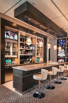 a sports themed bar with stools and lights