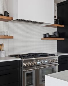 a stove top oven sitting inside of a kitchen