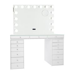 a white dressing table with drawers and a mirror