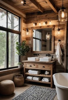 a bathroom with a tub, sink and large mirror in it's center area