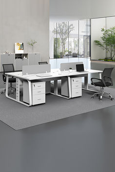 This desk and chair set offers a minimalist design with practical functionality. Featuring adjustable legs for customizable height and a built-in partition for added privacy, it's perfect for creating a focused and organized workspace. The 4-seater configuration accommodates multiple users comfortably, making it ideal for offices, study rooms, or collaborative spaces. The sleek design and durable materials ensure both style and long-lasting use. #Modern Desk #Office Staff Desks #Corner Desks