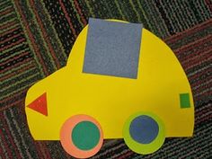 a yellow paper car sitting on top of a carpet