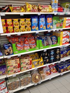 a grocery store filled with lots of different types of food and snacks on the shelves