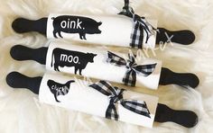 three pairs of socks with black and white animals on them, tied to each other