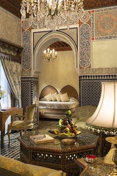 an ornately decorated living room with chandelier