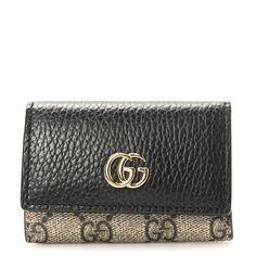 This is an authentic GUCCI Dollar Calfskin GG Supreme Monogram GG Marmont 6 Key Holder Case in Black, Beige and Ebony. This case is crafted of GG supreme monogram coated canvas and black calfskin leather front flap with a polished gold GG logo. The front flap unsnap opens to a black leather interior with six polished gold key rings and patch pocket. Gold Key, Gg Logo, Gg Marmont, Key Holder, Leather Interior, Key Rings, Patch Pocket, Calf Skin, Black Leather