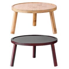 a small wooden table sitting on top of a black and red stool with two legs