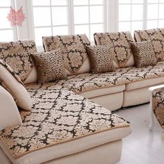 a living room filled with lots of couches and pillows on top of each other