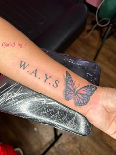 a woman's arm with a butterfly on it and the words ways written in black ink