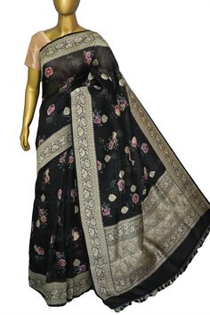 With detailed digital print work done with intricate detail makes this designer collection one of the sorted and unique buys to try for any light occasion or party in a great onyx black color. It is beautifully paired with woven zari work on the border and the pallu and mandala butta work on the body makes this saree unique. Color: A shade of onyx black color Technique: Amazing work of traditional zari weaving on the whole saree with digital floral print work on the body Fabric: Organza Quality: Tussar Silk Blouse Piece For Party, Semi-stitched Black Art Silk Blouse Piece, Designer Black Banarasi Silk Saree, Designer Digital Print Saree For Eid, Designer Black Tussar Silk Saree, Black Dupatta With Zari Weaving For Designer Wear, Traditional Party Wear With Printed Motifs, Designer Black Banarasi Silk Blouse Piece, Black Silk Saree With Zari Work