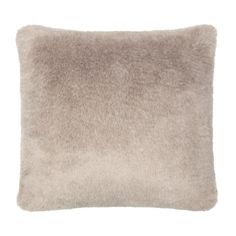 the pillow is made from faux fur and has a square shape with a soft, fluffy feel