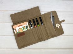 Stationery case Carry your writing tools with you in our cool roll-up pencil case. With capacity for a notebook and 5 pen holders plus a zipper compartment for small items. Throw it in your bag and go for the adventure. Open it and have it all ready at a glance. This cool pencil case will allow you to carry a notepad, pens and some small items in a Lots of stationery to carry? no problem, we have the bigger version of this case, check it here ► DESCRIPTION ✔ zippered pocket with metal zipper ✔ 5 Cheap Portable Pencil Case As Gift, Cheap Portable Pencil Case Gift, Cheap Bags With Pen Holders For Personal Use, Cheap Bags With Pen Holders, Handmade Fabric Pencil Case, Functional Pencil Case With Zipper Pocket, Roll Up Art Case, Cheap Pencil Shaped Organizer With Zipper Closure, Pencil Organizer With Pen Holders For Gift