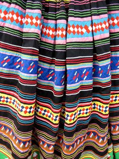 the colorful skirt is hanging up on display