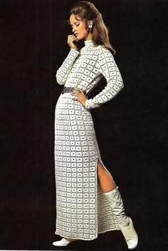 a woman in a white dress and boots posing for a magazine cover with her hand on her hip