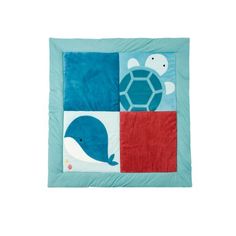 a blue and red quilted wall hanging with a turtle on it's back